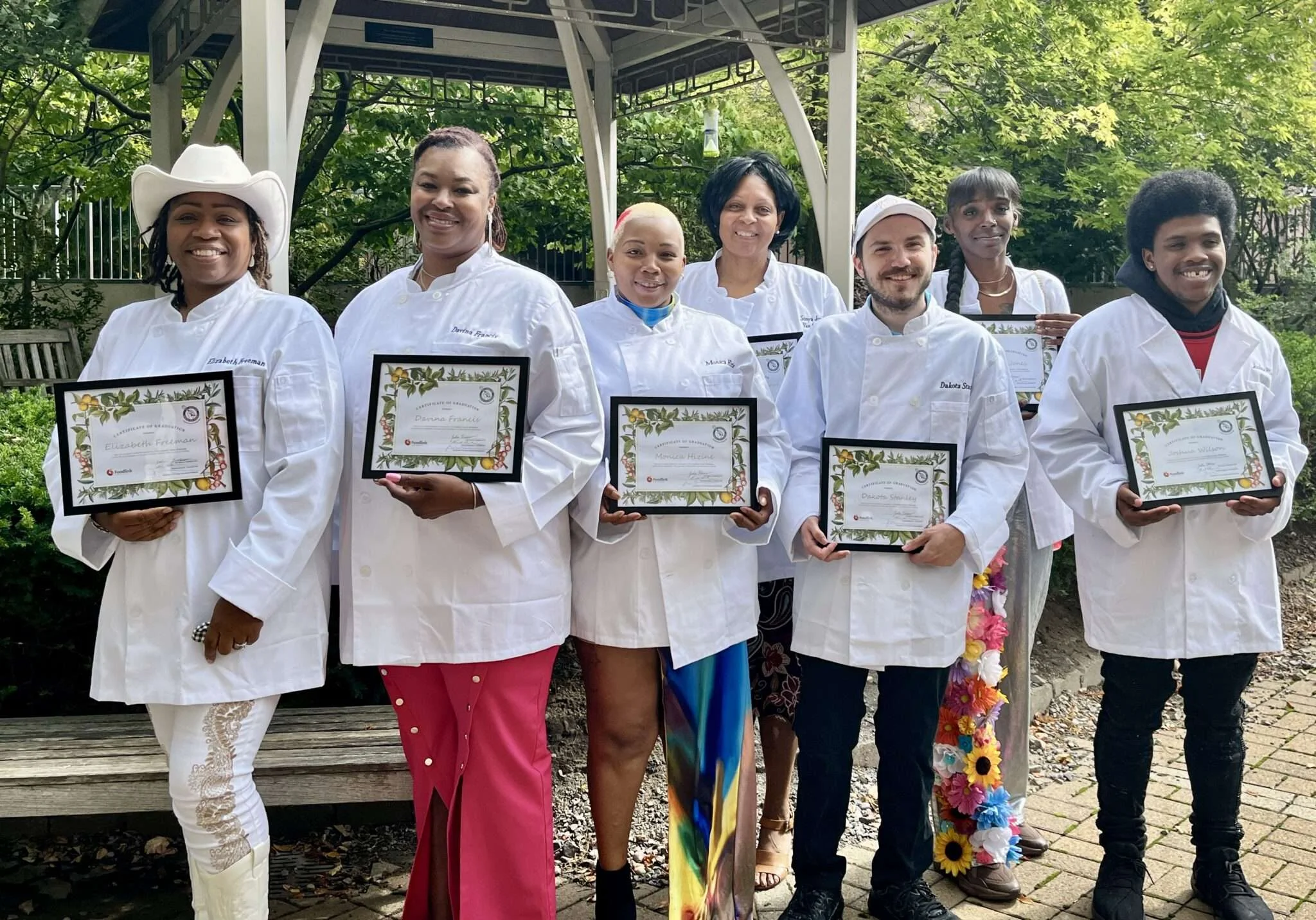 Class of 2024 (Class #8), from left: Elizabeth Freeman, Davina Francis, Monica Hizine, Sonya Jordan Van Alstyne, Dakota Stanley, Kadijah Jones,, and Joshua Wilson.